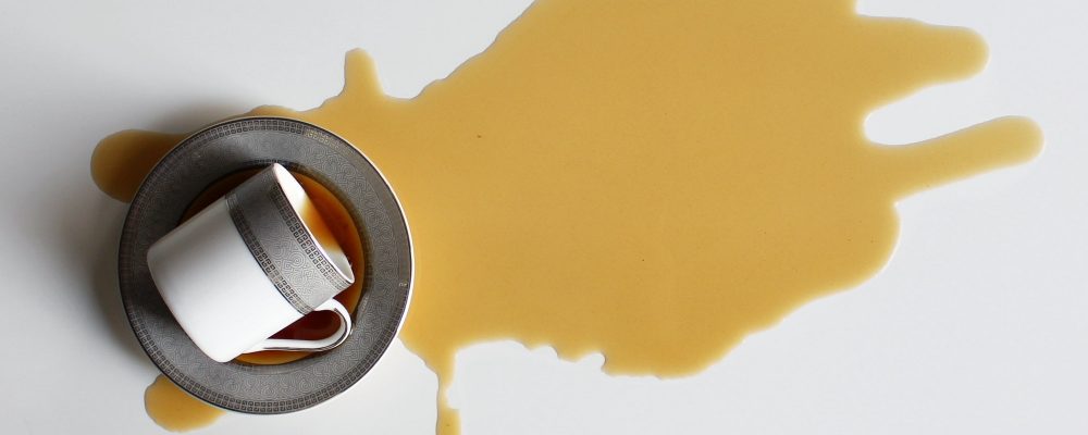 Tea spilled on white background Tea spilled on white background